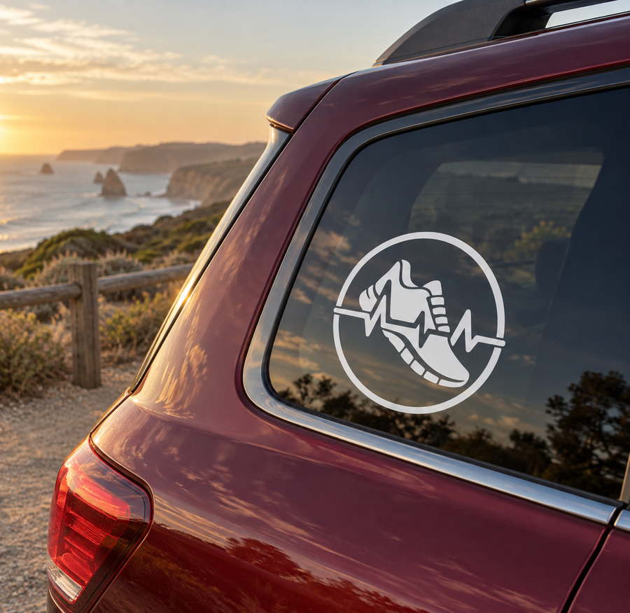 Circular vinyl decal with black running shoe and heartbeat waveform inside a white badge
