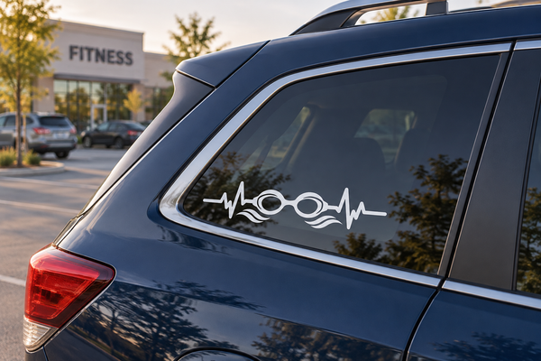 White pulse line vinyl decal with swimmer goggles and wave details on car window