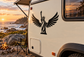 Statue of Liberty wings vinyl decal, black silhouette on a vehicle side panel