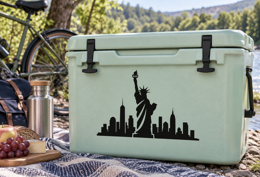 Vinyl decal with black Statue of Liberty and city skyline silhouette on a cooler