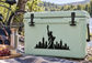 Vinyl decal with black Statue of Liberty and city skyline silhouette on a cooler