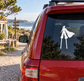 Vinyl decal silhouette of a woman in cape on a car rear window
