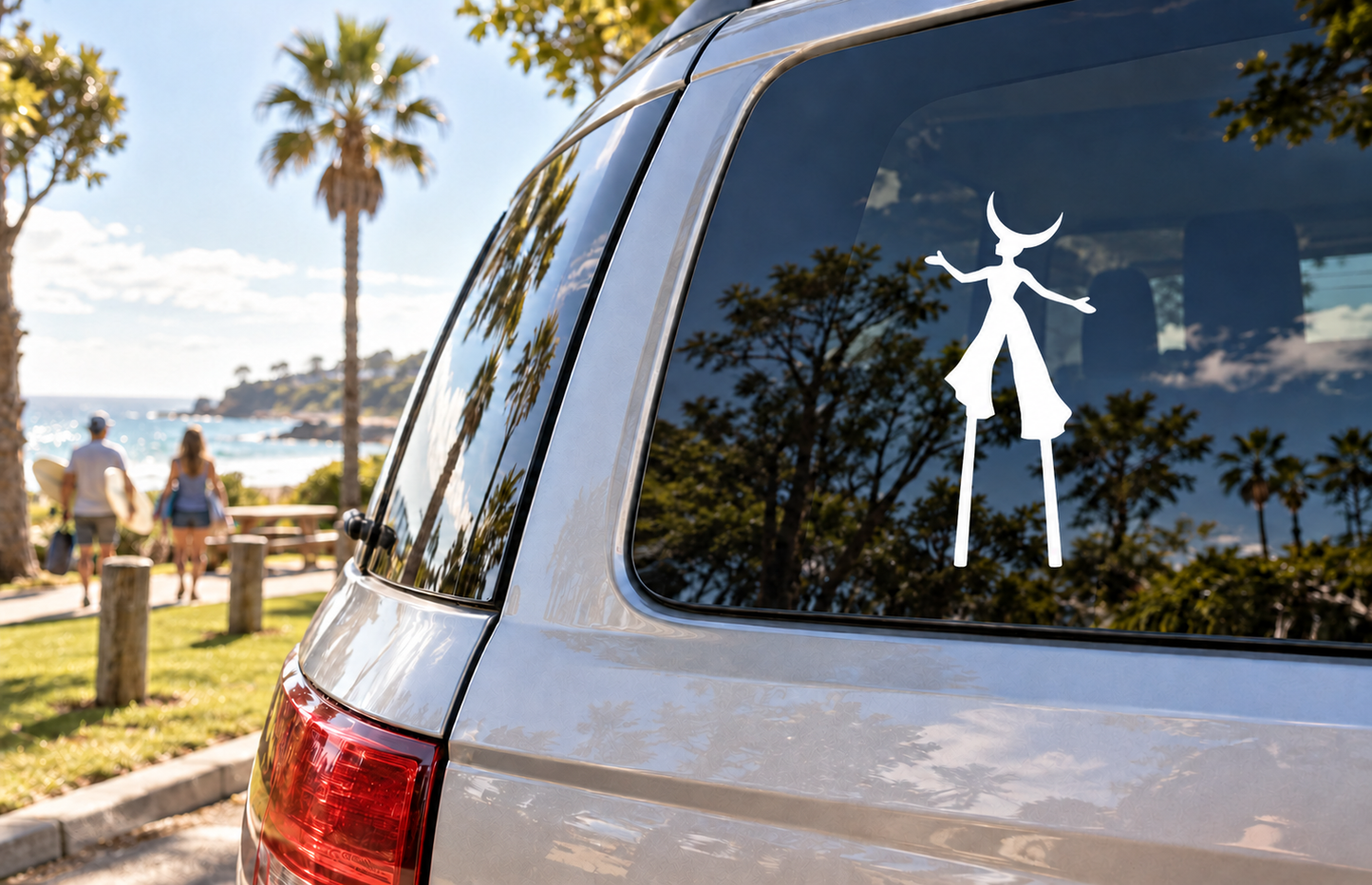 Vinyl decal of a dancing girl with crescent moon on a vehicle window