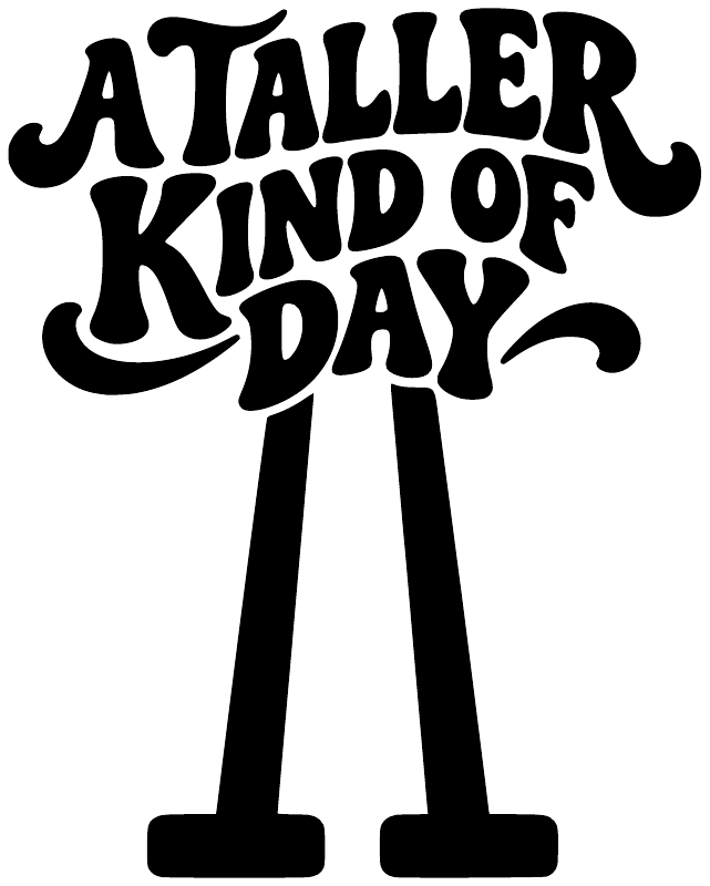 Vinyl decal graphic: 'A Taller Kind of Day' lettering with black stilt figures