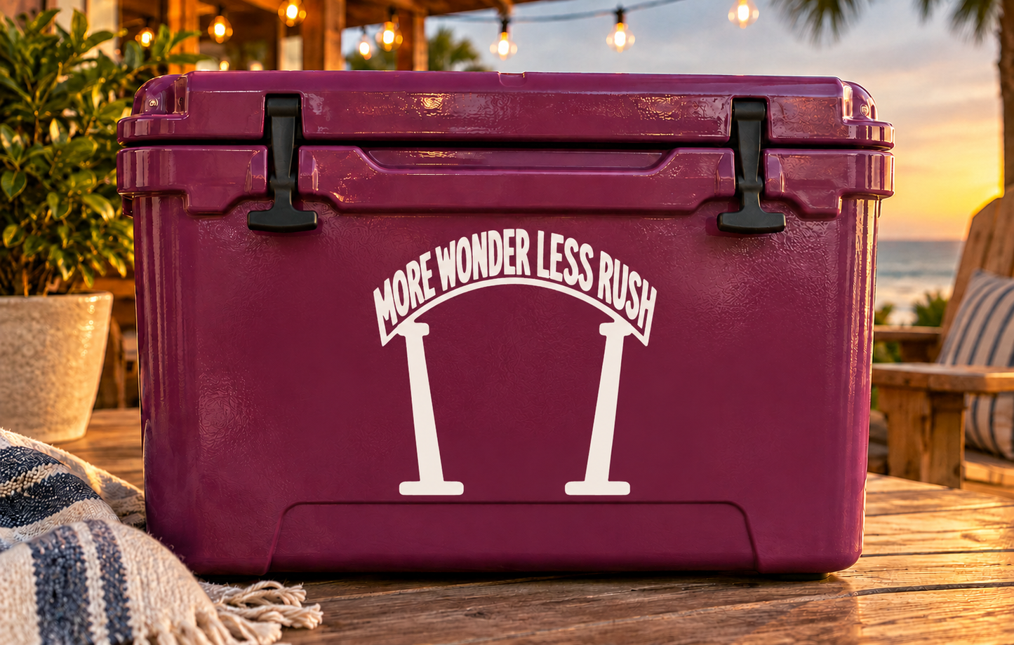 Vinyl decal: white “More wonder less rush” text with hourglass icon on purple