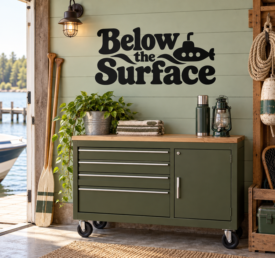 Below the Surface vinyl decal with submarine graphic on a wall, black lettering.