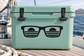 Teal vinyl decal with black sunglasses graphic and window-style striped lenses