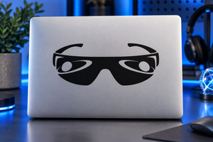 Sunglasses vinyl decal with oversized eyes and black frames on a laptop lid