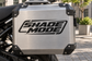 Shade Mode vinyl decal on a rectangular metal panel, black and white logo