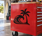 Black palm tree and surf wave vinyl decal on red panel