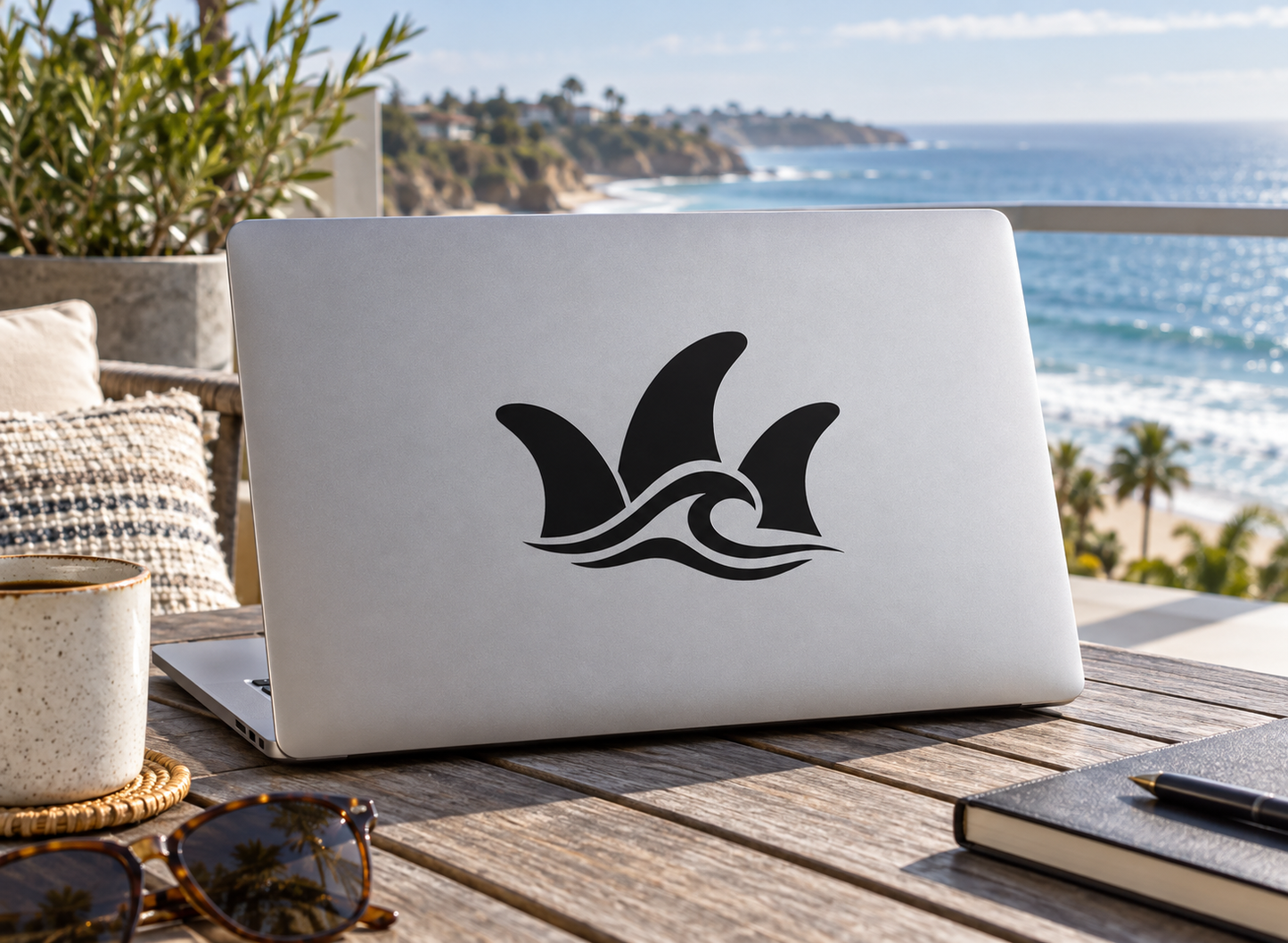 Surfing fin trio vinyl decal with black three-fin icon on a light surface