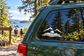 Vinyl car decal with mountain peaks, swimmer silhouette, and wave lines