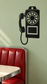 Retro payphone vinyl decal, black telephone handset and keypad design.