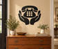 Hands holding telephone vinyl decal, black phone with keypad detail