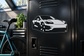 Three-quarter Tesla Model S vinyl car decal in white on dark surface