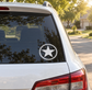 Circular rope ring vinyl decal with black Texas star on car window