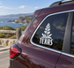 Texas vinyl decal with leaf floral sprig on rear window, white lettering