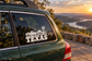 Texas ranch pickup vinyl decal with TEXAS text and windmill on car window, white and black