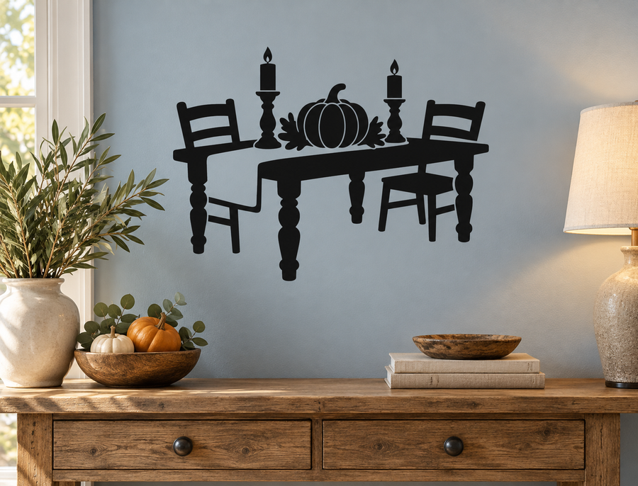 Black vinyl decal of dining table with pumpkin, candles, and two chairs
