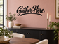 Thanksgiving vinyl wall decal with black “Gather Here” script text
