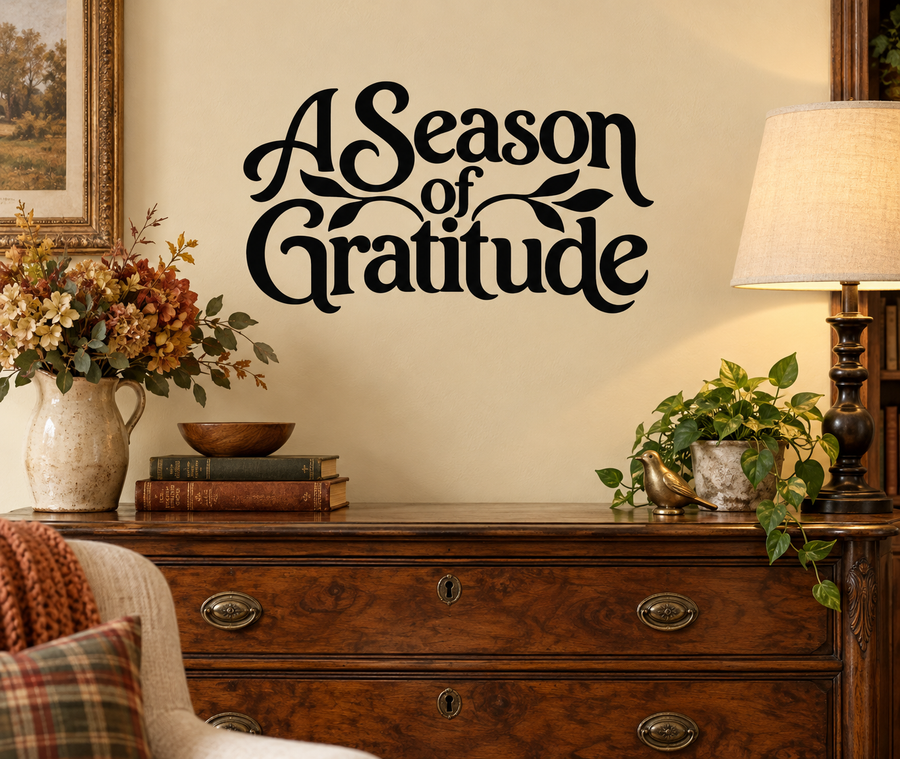 Vinyl wall decal reading "A Season of Gratitude" in black with leaf swirls