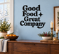 Black vinyl decal reading Good Food Great Company with star