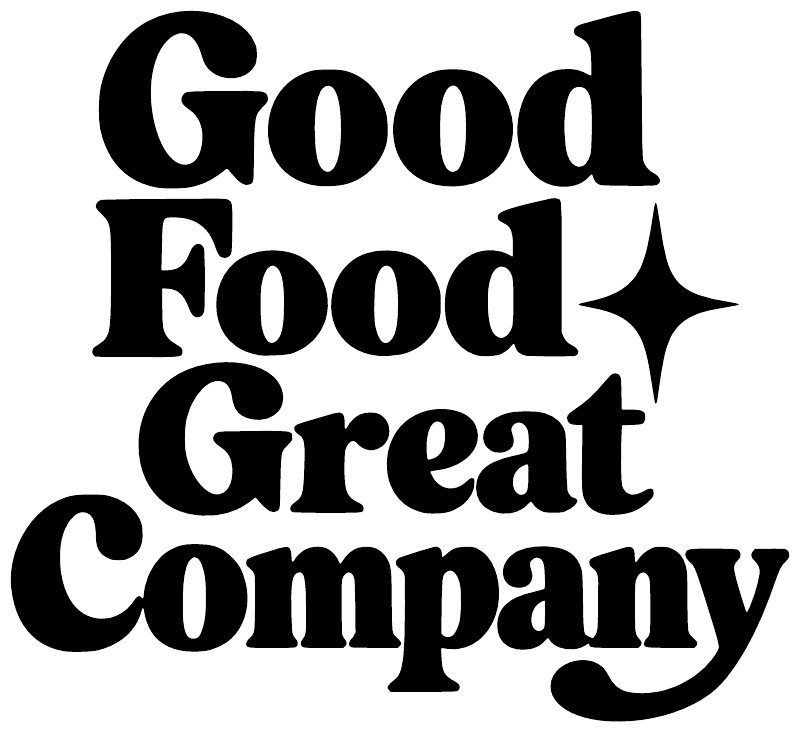 Close-up of black vinyl decal text Good Food Great Company with star
