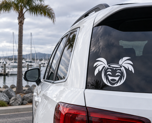 Tiki coconut character vinyl decal, black-and-white on car rear window