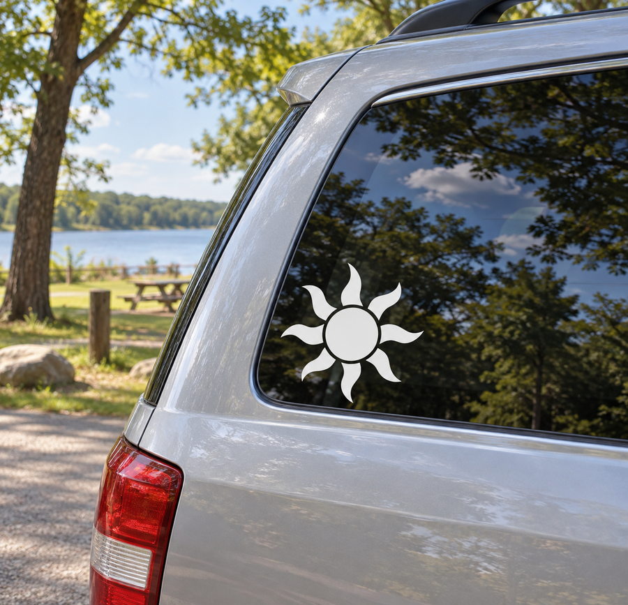 Tiki sunburst vinyl decal for car window, white sun icon on dark background