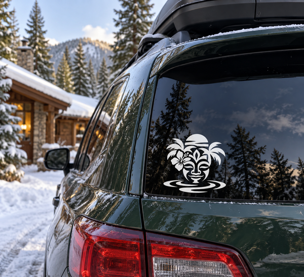 Tiki face vinyl decal with waves and palm leaves on a car rear window