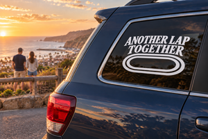 Vinyl decal reading "ANOTHER LAP TOGETHER" on car rear window