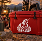 Red cooler with white unicorn and wildflower vinyl decal centered on front