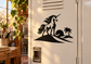 Unicorn vinyl decal of black unicorn standing on a desert dune with palm trees