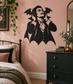 Bat-wing vampire vinyl decal with black headphones silhouette on a wall