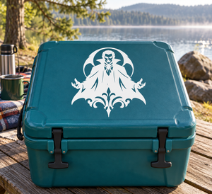 White ornate broad-fang vampire emblem vinyl decal on teal surface