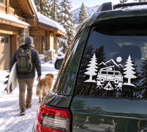 Vinyl decal on van rear window, white camper setup with trees and mountains