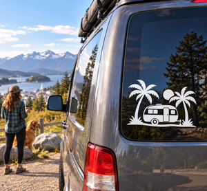Palm Coast van vinyl decal with camper trailer, palm trees, and desert scene on rear window