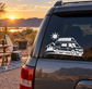 Off-grid solar van vinyl decal on dark van with sun, mountains, and camper van outline