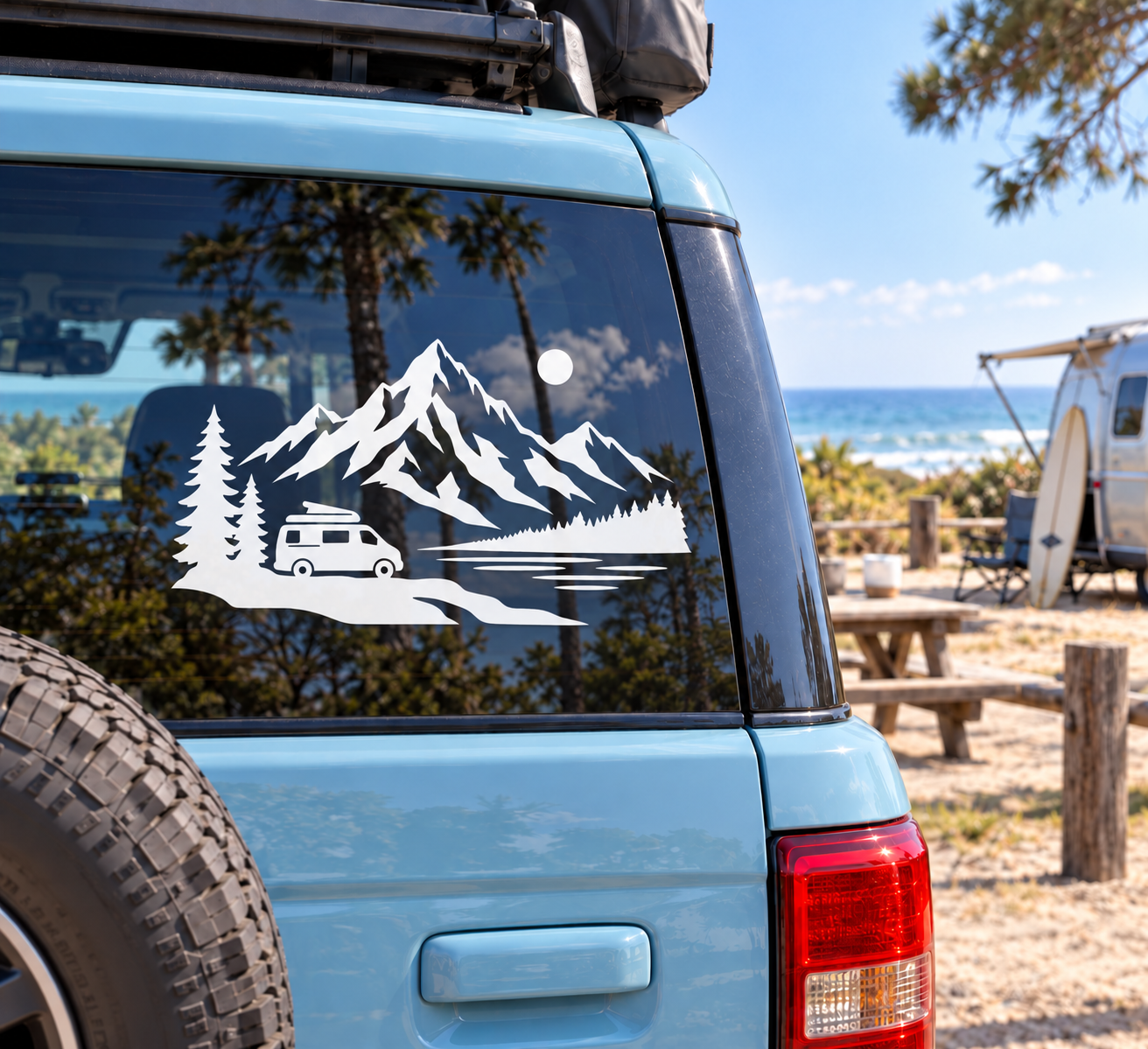 Vinyl decal for van: black mountain landscape with pine trees and small camper van.