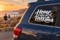 Vinyl decal: 'Home is where we park' with car and evergreen trees