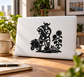 Viking gardener vinyl decal: black Viking with shovel by flowers