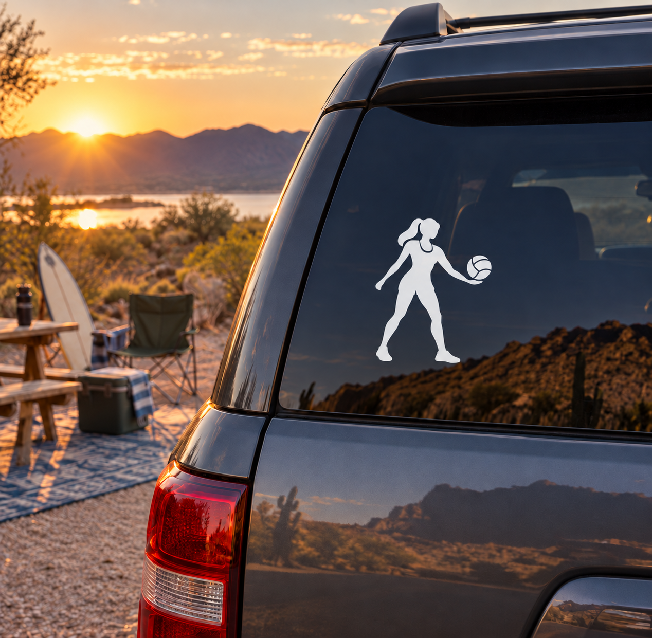 Volleyball player vinyl decal on dark car rear window, holding a volleyball