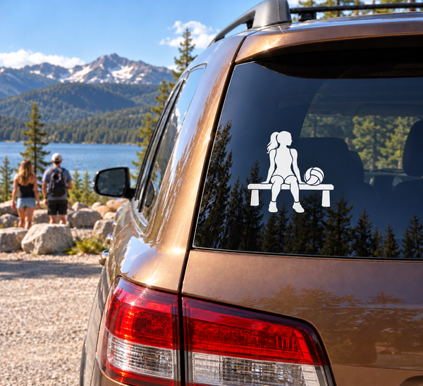Volleyball bench vinyl decal of seated girl holding a volleyball on car window