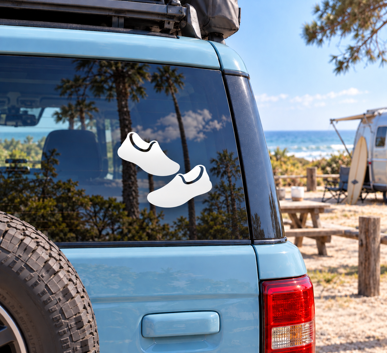 Volleyball court shoes vinyl decal, two black shoes with white outline on car window