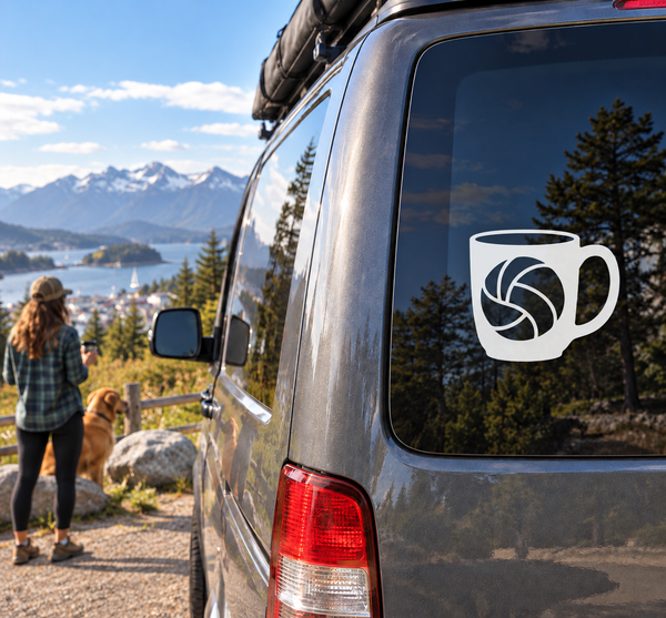 White mug-shaped vinyl decal with volleyball emblem on car window