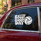 Car window vinyl decal: 'RALLY GOOD DAY' text with volleyball icon in white and black
