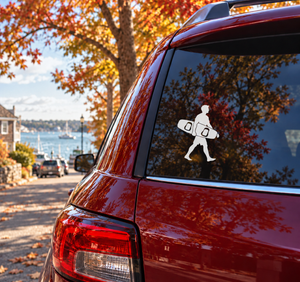 Vinyl wakeboarding board-carry decal on red car rear window