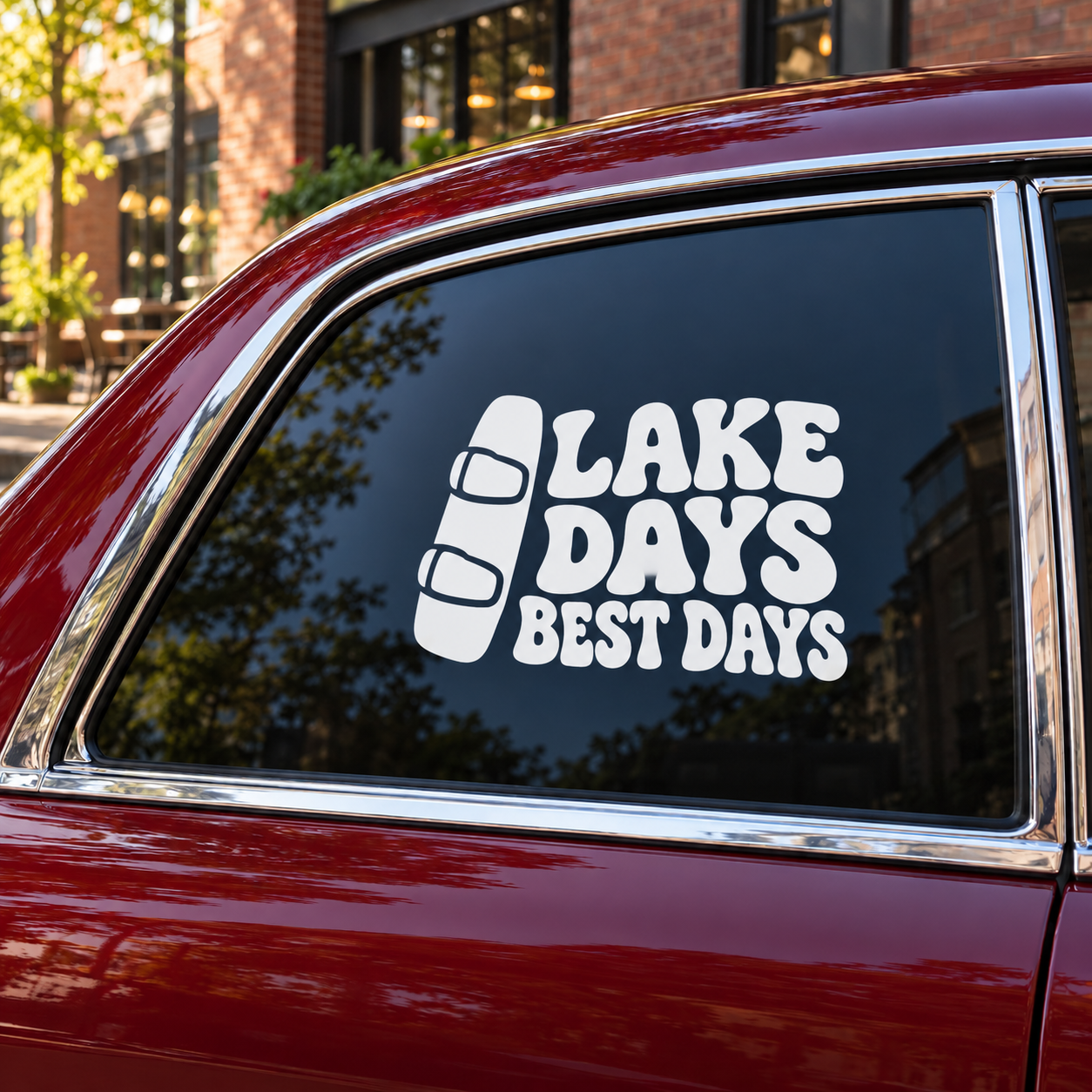 Vinyl decal with “Lake Days Best Days” life jacket graphic on a car window