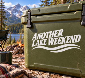 Another Lake Weekend vinyl decal with black text and wave graphic on dark green surface