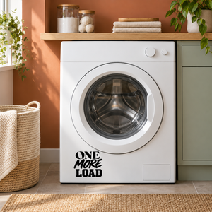 Black “ONE MORE LOAD” vinyl decal on a white washing machine door.